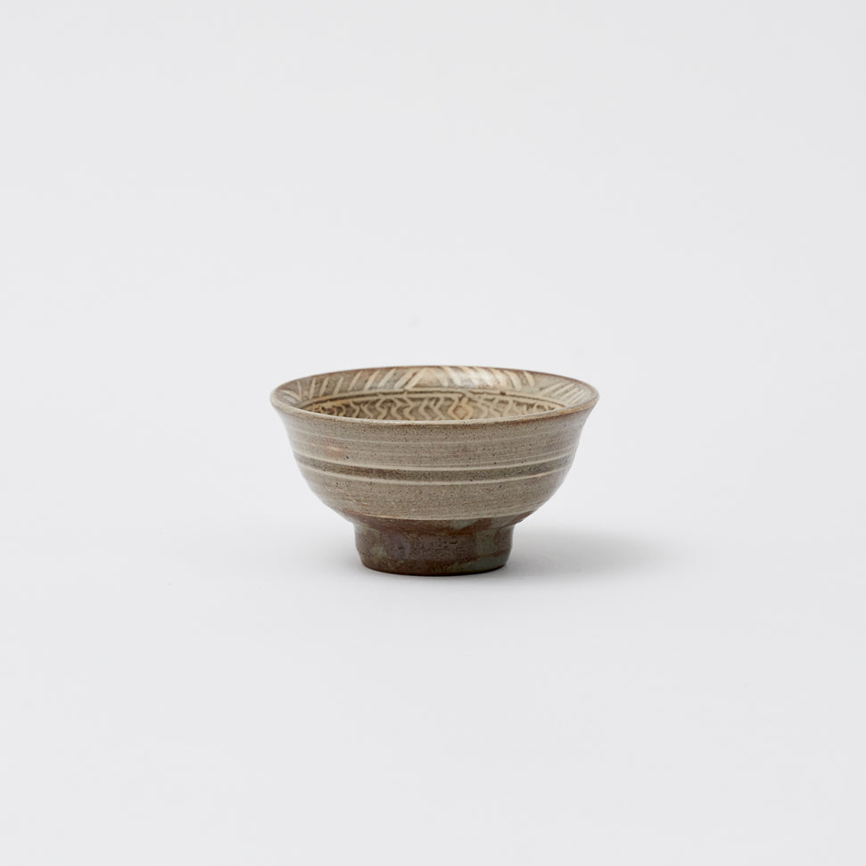 Buncheong cup with a flower pattern