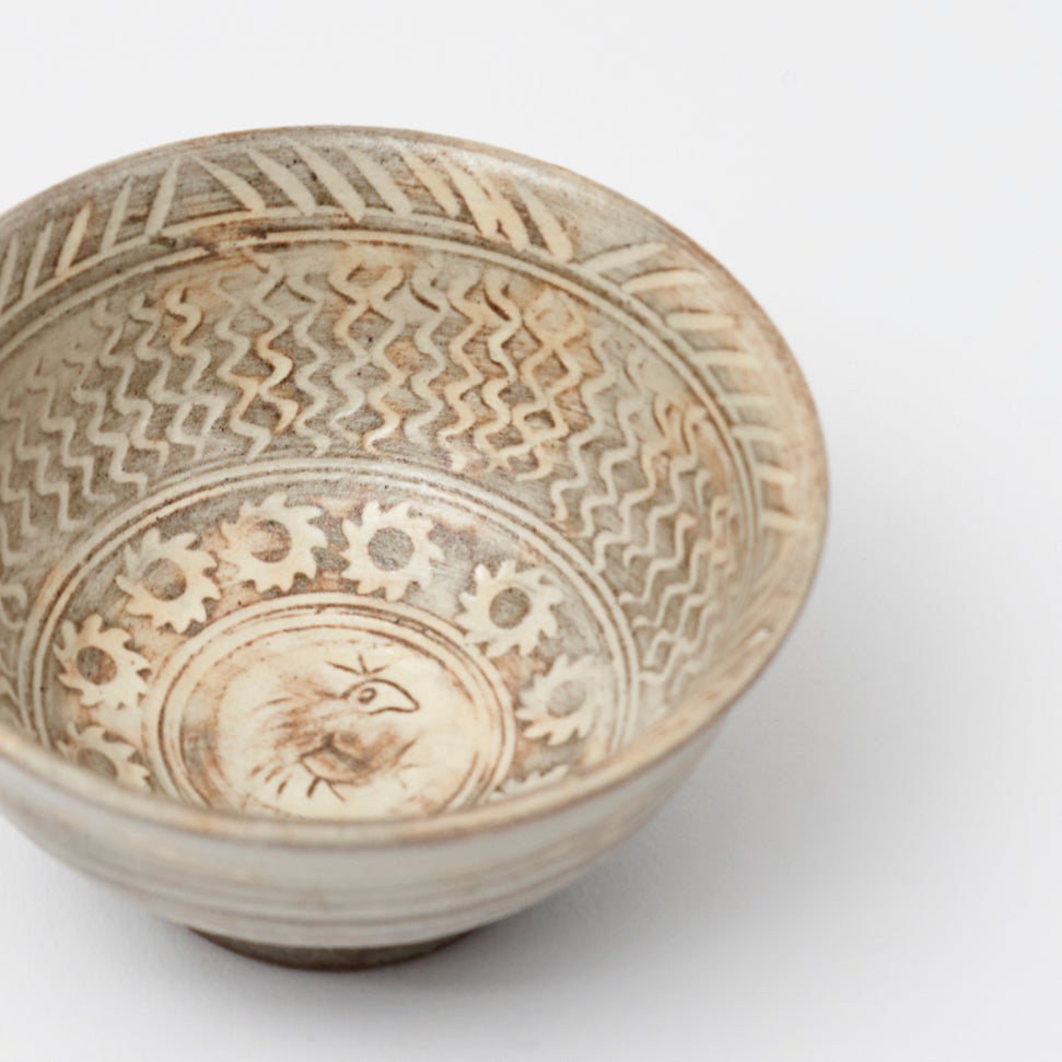 Buncheong cup with a flower pattern